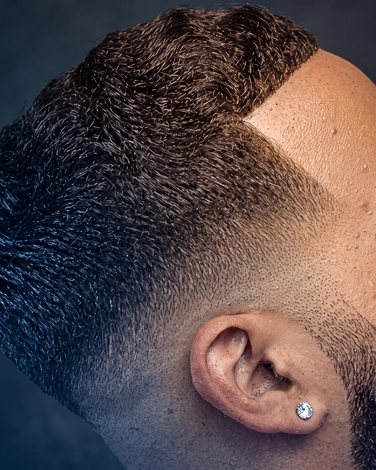 Skin fade with a sharp lineup and beard blend